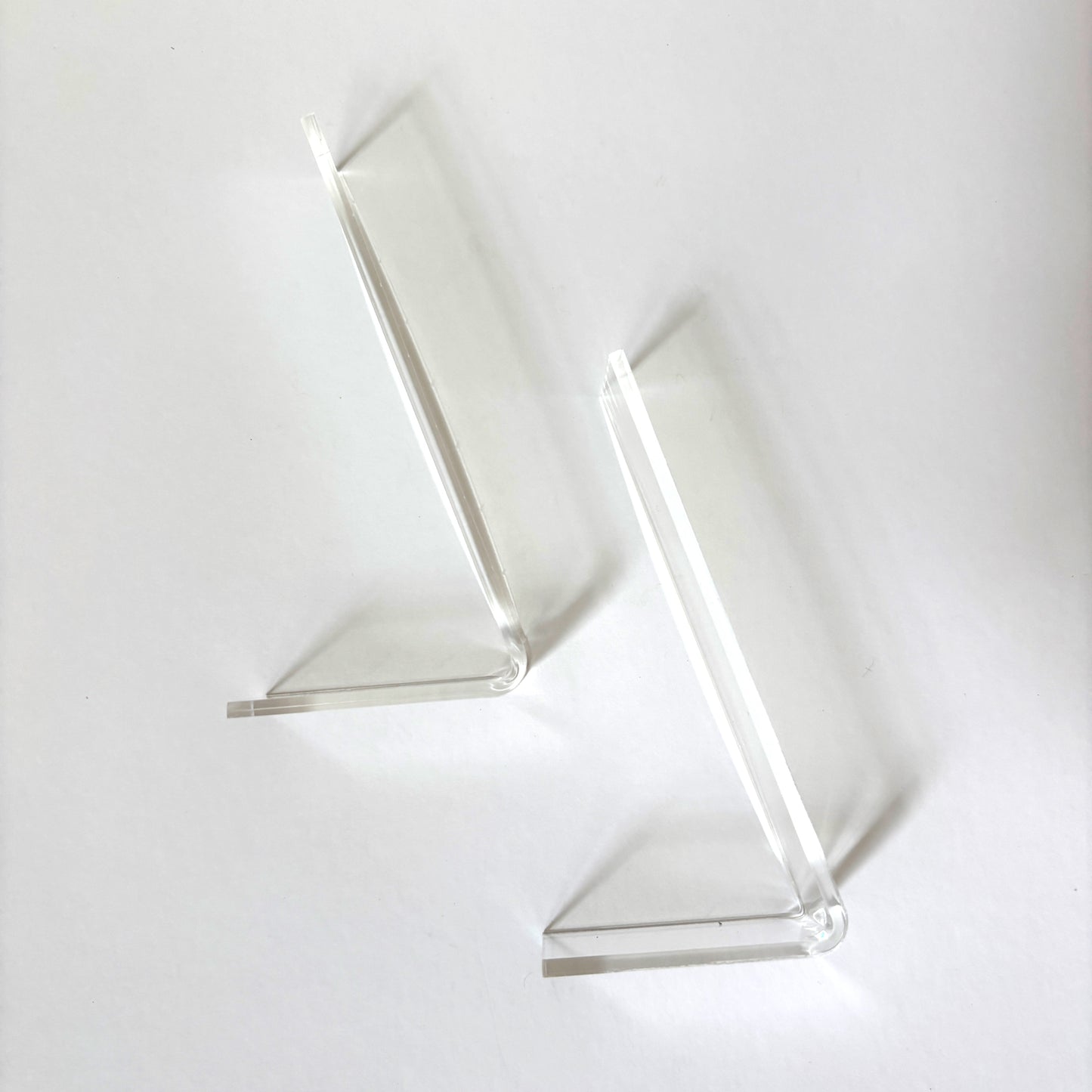 Close-up of acrylic stand base showing 1.5 inch width and clear acrylic construction for displaying finished needlepoint standups