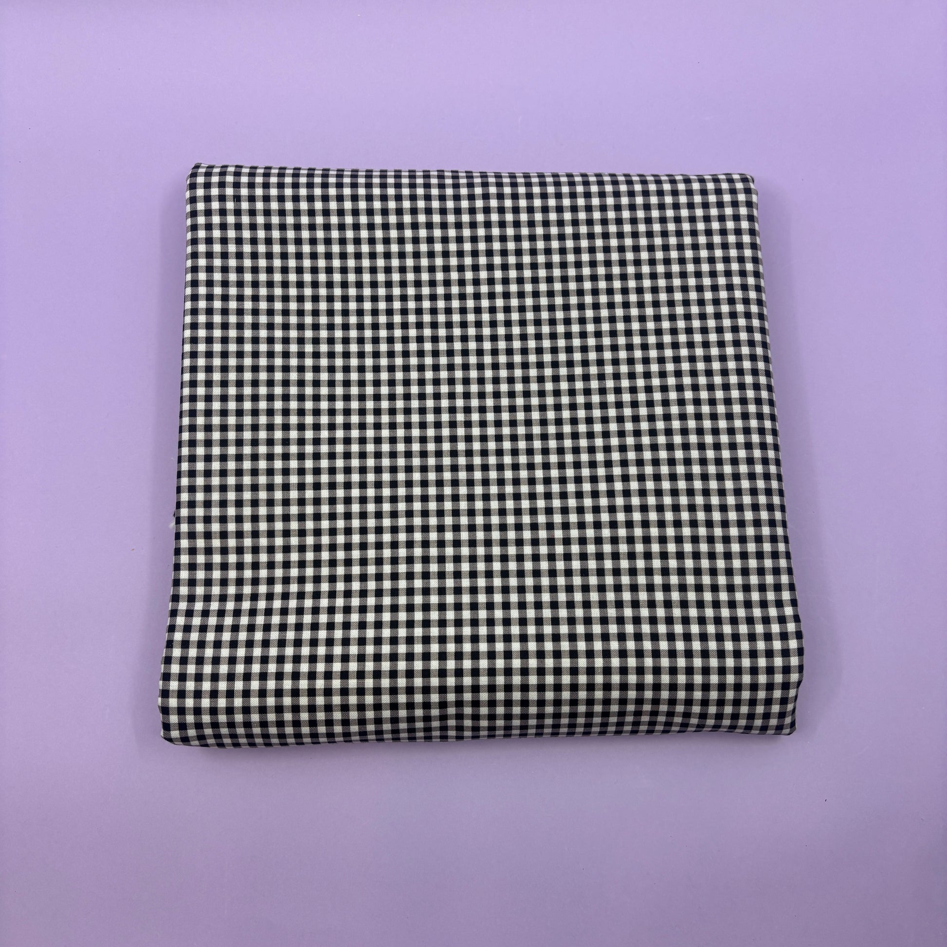 Gingham fabric cut for needlepoint finishing, 12 x 38 inches, shown flat in a classic check pattern ideal for ornament and standup backing. Black and white.