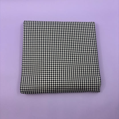 Gingham fabric cut for needlepoint finishing, 12 x 38 inches, shown flat in a classic check pattern ideal for ornament and standup backing. Black and white.
