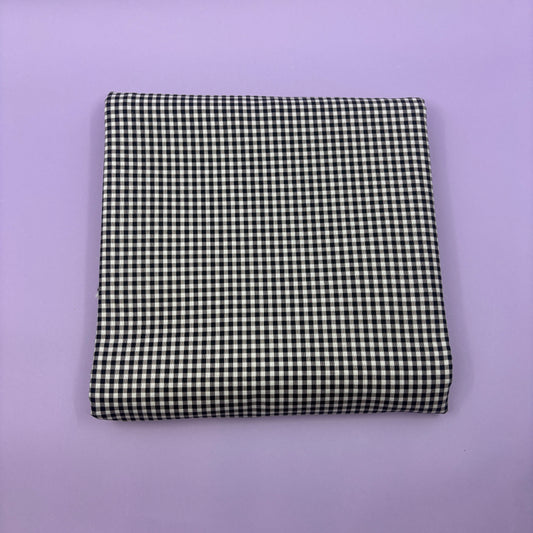Gingham fabric cut for needlepoint finishing, 12 x 38 inches, shown flat in a classic check pattern ideal for ornament and standup backing. Black and white.
