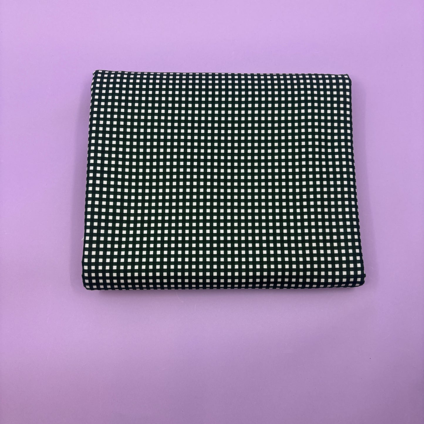 Gingham fabric cut for needlepoint finishing, 12 x 38 inches, shown flat in a classic check pattern ideal for ornament and standup backing. Black and white.