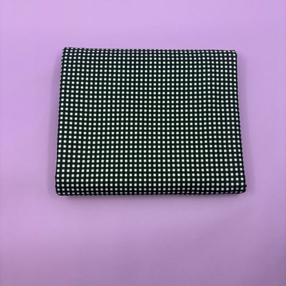 Gingham fabric cut for needlepoint finishing, 12 x 38 inches, shown flat in a classic check pattern ideal for ornament and standup backing. Black and white.