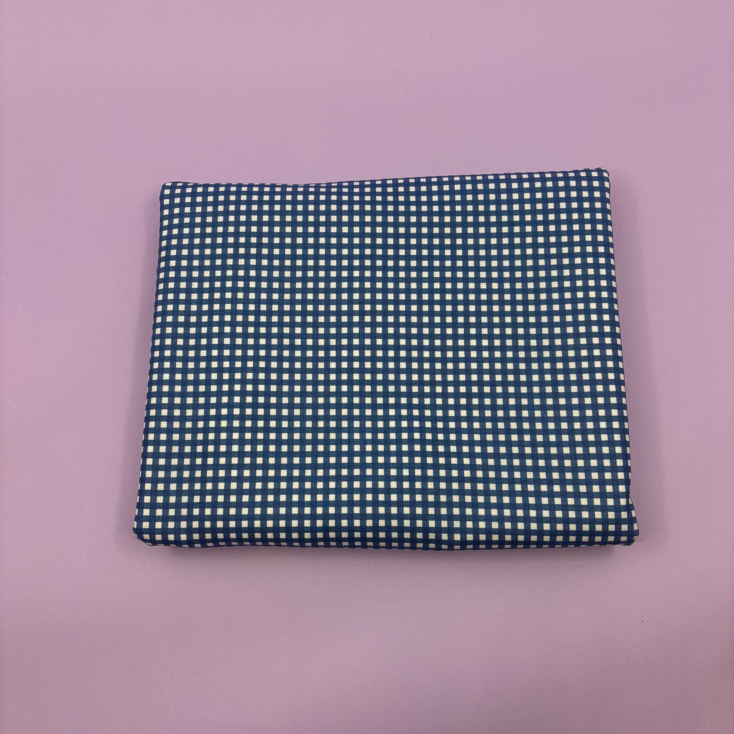 Gingham fabric cut for needlepoint finishing, 12 x 38 inches, shown flat in a classic check pattern ideal for ornament and standup backing. Blue and white.