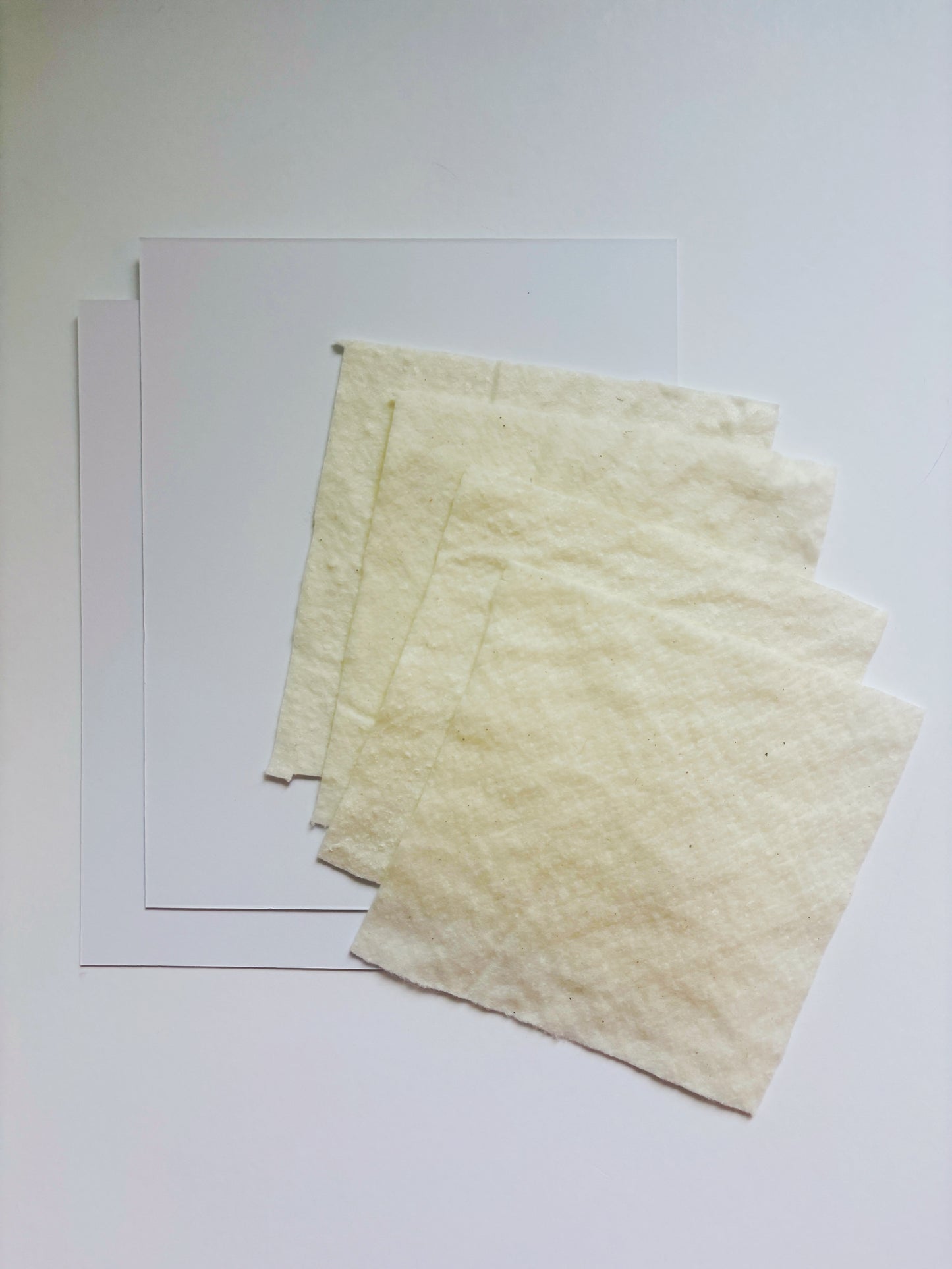 Needlepoint finishing resupply pack containing 2 sheets of acid-free matboard 8 x 11 inches and 4 sheets of Warm and Natural batting 6 x 6 inches for finishing 2 additional round ornaments